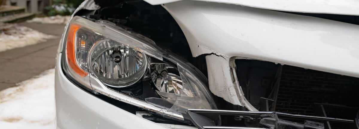 silver car after head-on crash