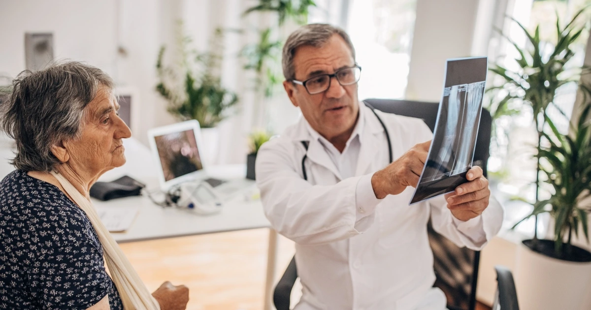 A doctor showing a patient an X-ray